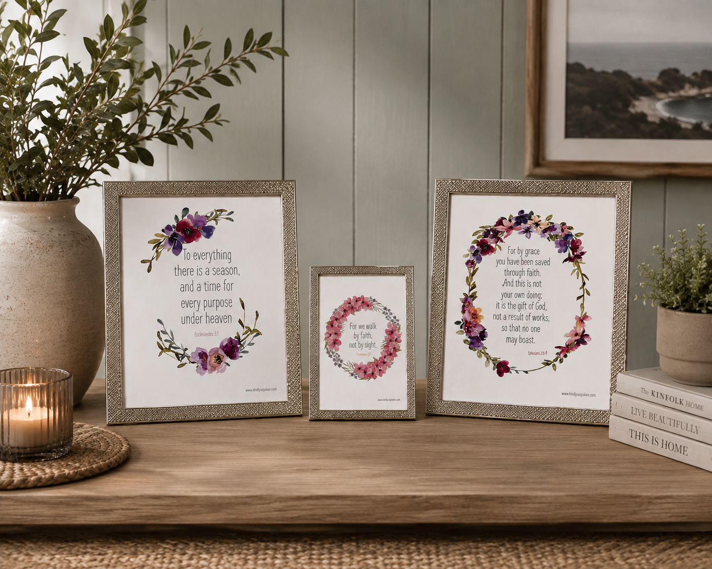 Set of three standing picture frames of varying sizes and metallic finishes Silver frame each containing a printed Bible verse adorned with watercolor floral wreaths.